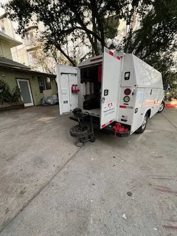 Magnet Plumbing service vehicle on-site for Grease Trap Cleaning in La Riviera